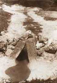 Two large stone slabs at mouth of channel