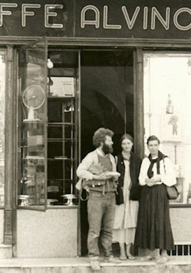 Slobodan standing in a doorway with piece of lumber